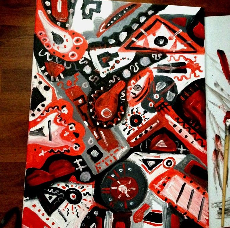 Abstrakt v červenočernobílé, plno geometrických tvarů s detaily.
